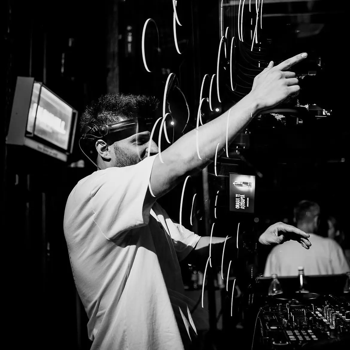 Black and white shot of Cloud9 pointing to the crowd amid light trails