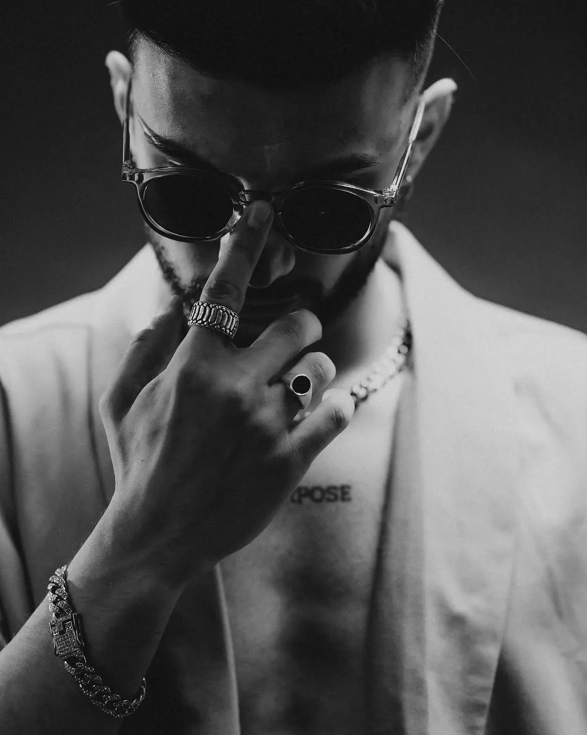 Black and white studio portrait of Cloud9 in sunglasses and a light blazer